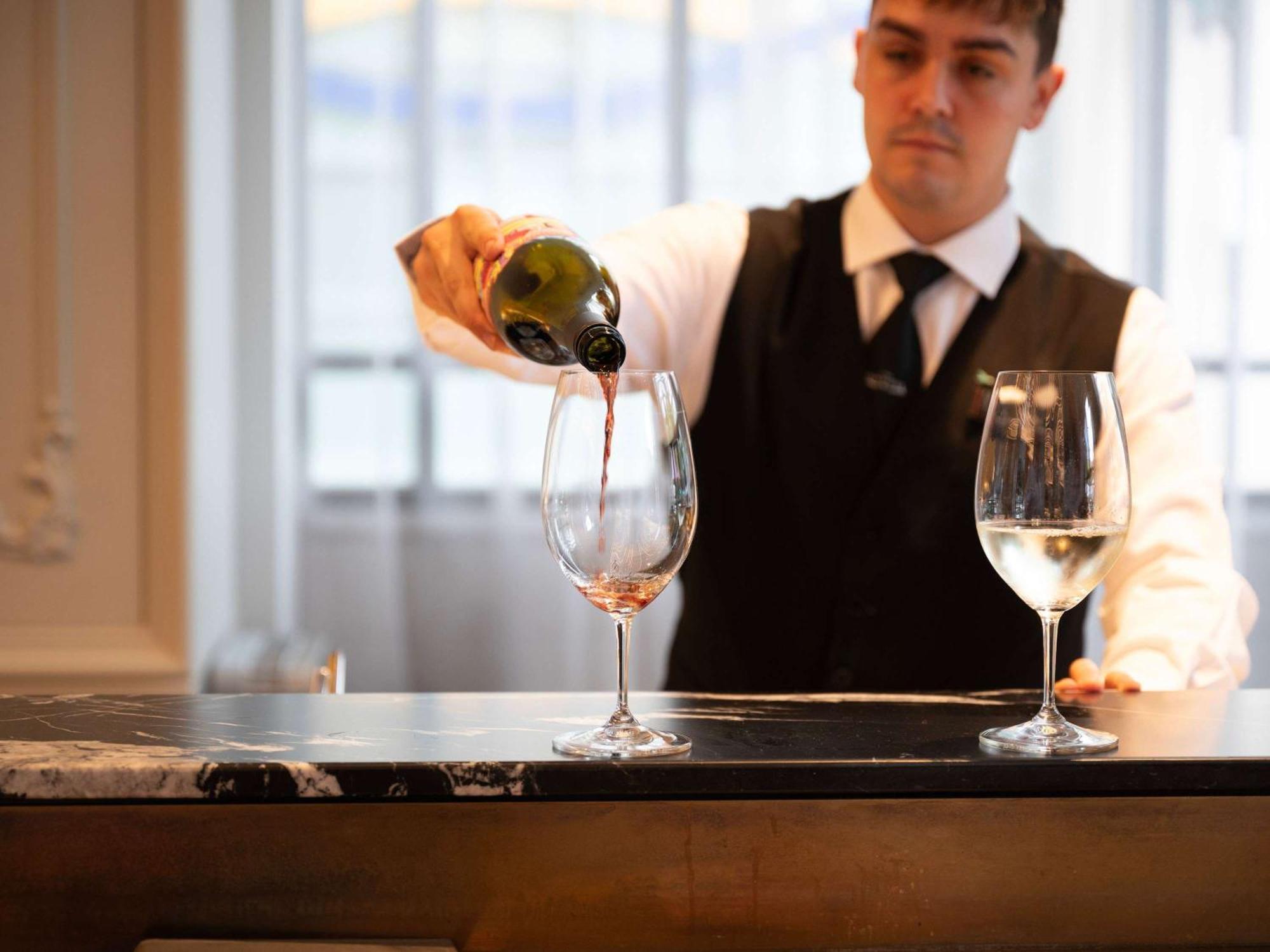 The Playford Adelaide - Mgallery Екстер'єр фото A sommelier pouring wine