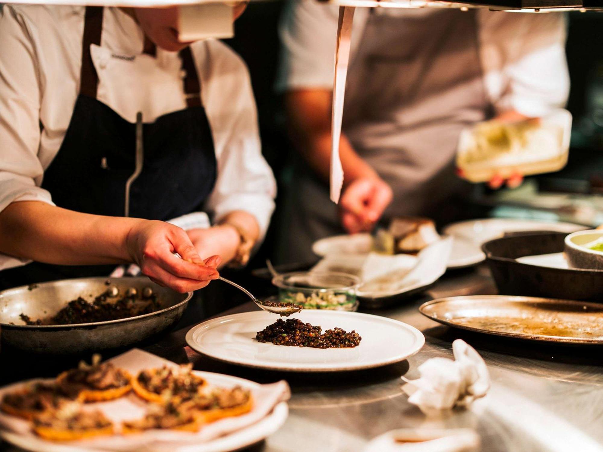 The Playford Adelaide - Mgallery Екстер'єр фото A chef plating a dish